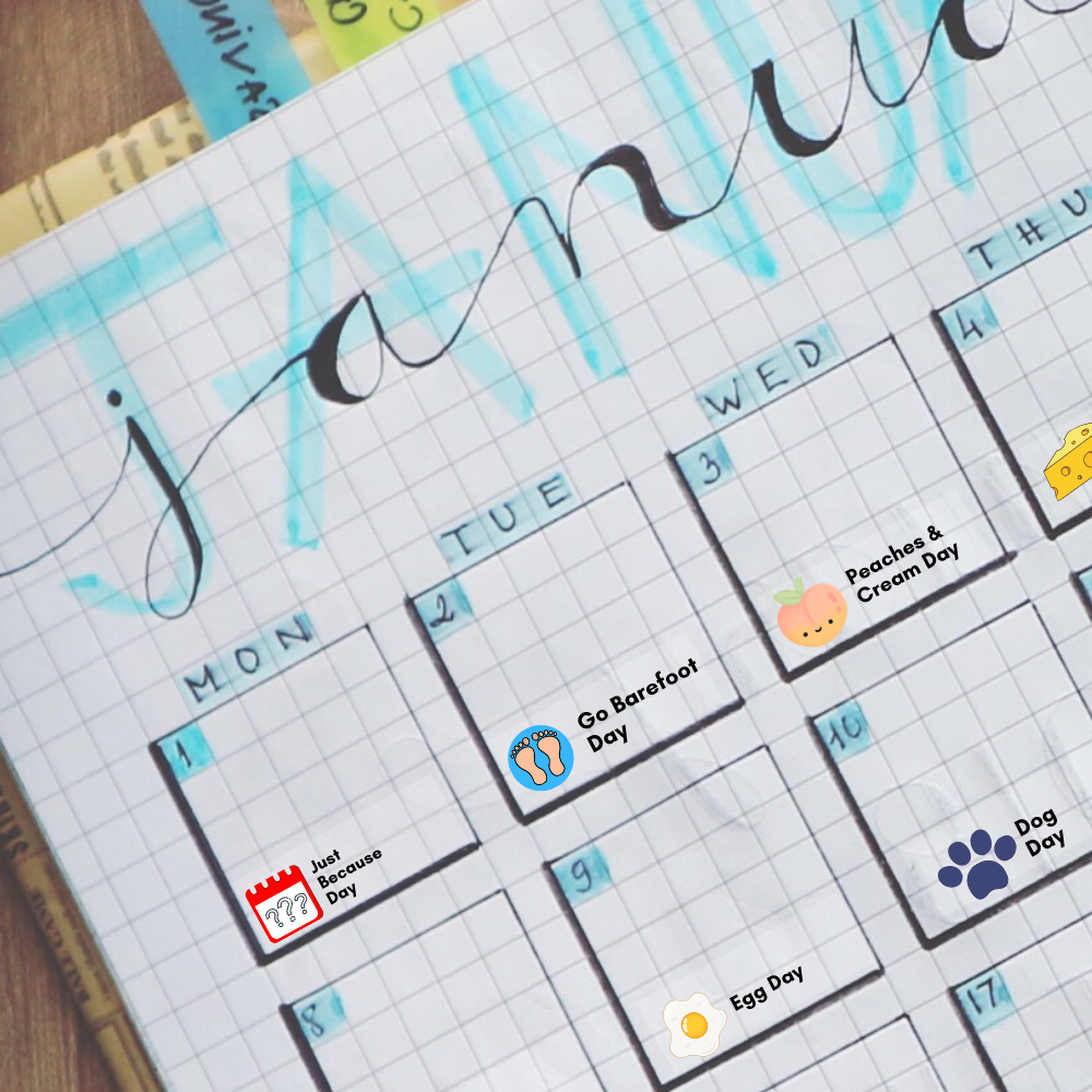 A bullet-journal style planner shows some quirky holiday stickers in use.