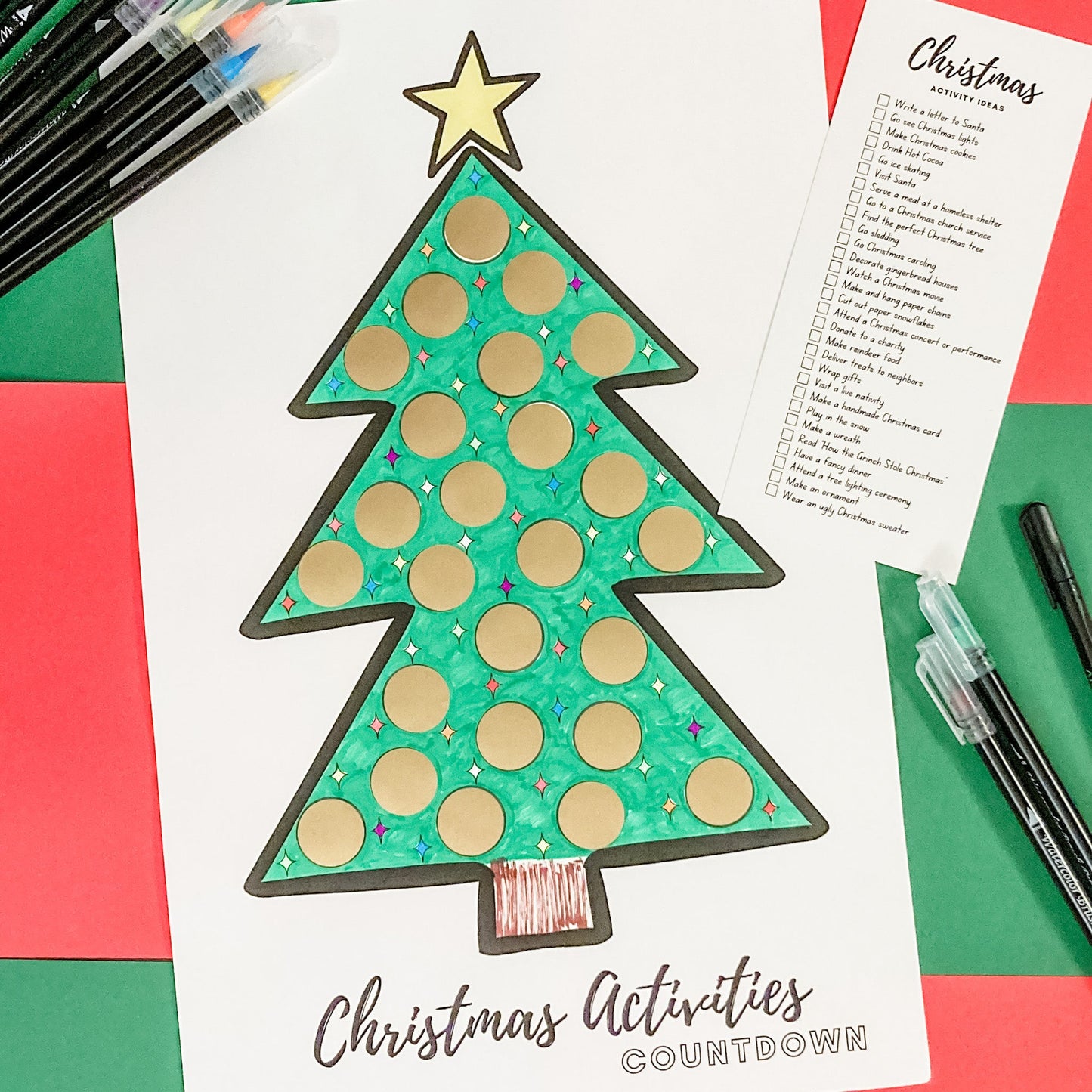 The Advent Scratch-off Christmas tree poster is displayed with each of it's spots covered with gold circle scratch-off stickers.