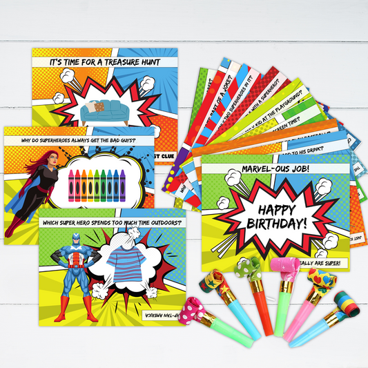 The cards for a superhero themed treasure hunt are displayed with some party blowers.
